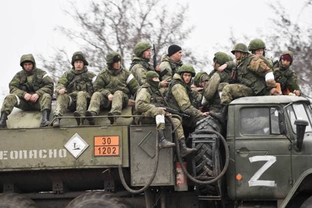 Russia Ukraine Military Operation 8125946 25.02.2022 Russian servicemen are seen in Armyansk in the northern part of Crimea, Russia. On February 24 Russian President Vladimir Putin announced a military operation in Ukraine following recognition of independence of breakaway Donbas republics.