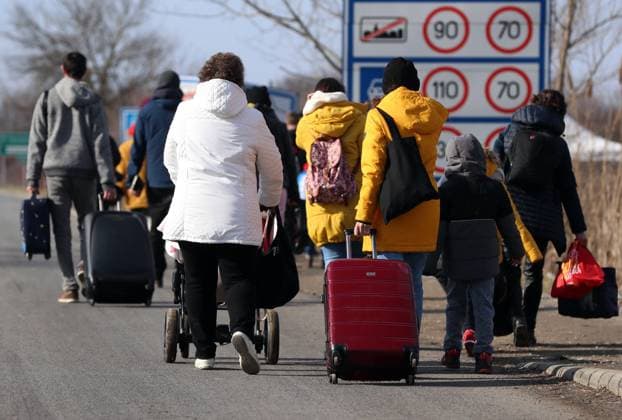 Refugees fleeing from Ukraine arrive in Hungary People walk as they flee from Ukraine to Hungary, after Russia launched a massive military operation against Ukraine, at a border crossing in Beregsurany, Hungary, February 25, 2022. MatijaxHabljak PIXSELL