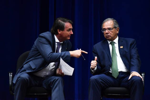BRASÍLIA, DF - 25.02.2022: BOLSONARO MODELO REGULATÓRIO INMETRO - Photo of President Jair Bolsonaro (PL) with Paulo Guedes, Minister of Economy, during the launch ceremony of the Inmetro Regulatory Model, this Friday (25) in Brasília DF. x2174644x  AntonioxMolina