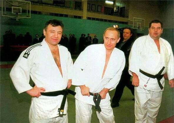 Before rising to power as one of the most infamous leaders in the world, Putin was a playful, hipster-dressing man in love. circa 1985, Russia: Young VLADIMIR PUTIN (in centre). St. Petersburg Russia - ZUMAz03_ 19850101_smk_z03_789 Copyright: xRussianxArchivesx
