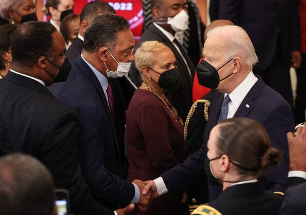 President Joe Biden shakes hands with the Reverend Jesse Jackson during a celebration of Black History Month at the White House on Monday, February 28, 2022 in Washington DC.  JEM20220228016 JEMALxCOUNTESS