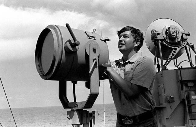 1979 - A signalman aboard the guided missile destroyer USS DEWEY (DDG-45) operates a signal light during exercise Unitas XX. . . 1062_05_l_-7514-