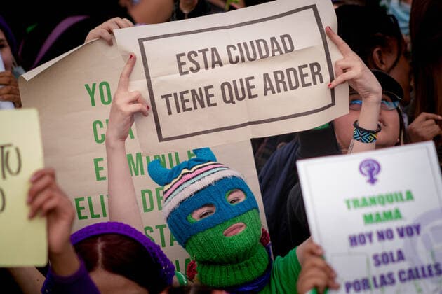 March 8, 2022, Bogota, Cundinamarca, Colombia: A demonstrator holds a sign that reads The city has tu burn as women participate in the international womes day demonstrations in Bogota, Colombia on March 8, 2022. Bogota Colombia - ZUMAvp1_ 20220308_zia_vp1_056 Copyright: xPerlaxBayonax