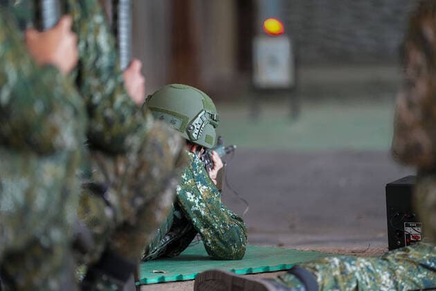 March 14, 2022, Nanshipu, Taiwan: An army reservist holds a riffle during the training at a camp base. Taiwan s military launched its new reservist training regimen that will provide more intensive periods of training in a bid to improve the combat readiness of reserve forces. Nanshipu Taiwan - ZUMAs197 20220314_zaa_s197_036 Copyright: xWalidxBerrazegx