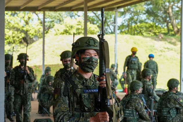 March 14, 2022, Nanshipu, Taiwan: An army reservist holds a riffle during the training at a camp base in Nanshipu. Taiwan s military launched its new reservist training regimen that will provide more intensive periods of training in a bid to improve the combat readiness of reserve forces. Nanshipu Taiwan - ZUMAs197 20220314_zaa_s197_035 Copyright: xWalidxBerrazegx