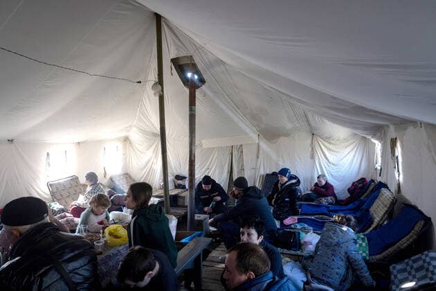 LUGANSK REGION, UKRAINE - MARCH 16, 2022: Evacuees are seen at a reception point for residents of the city areas of Lisichansk, Rubezhnoye, and Severodonetsk, set up by the emergencies ministry of the Lugansk Peopleâ€™s Republic on the outskirts of Starobelsk for further evacuation. Tension began to escalate in Donbass on 17 February, with the Donetsk People s Republic and the Lugansk People s Republic reporting the most intense shellfire in months. Early on 24 February, Russia s President Putin announced his decision to launch a special military operation in response to requests from the leaders of the Donetsk People s Republic and the Lugansk People s Republic. Stanislav Krasilnikov TASS  TS127FA1