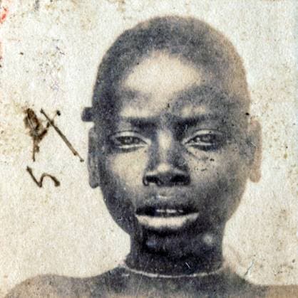 This photograph of a Liberated African slave was taken after they were freed from slaving ships by the British Navy. From 1861 to 1874, more than 2500 Liberated Africans were shipped to Port Victoria, Seychelles.<br ><br > While the Slave Trade continued across eastern and southern Africa and the Indian Ocean, the liberated were taken to a depot, classified by the District Magistrate, photographed, renamed, and assigned as apprentices to the French-owned plantations, where they were indentured for five years. Supplier:xCPAxMediaxCo.xLtd. 1060_05_CPA0031773