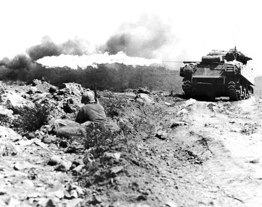 The invasion of Iwo Jima began on February 19, 1945, and continued to March 27, 1945. The battle was a major initiative of the Pacific Campaign of World War II. The Marine invasion was charged with the mission of capturing the airfields on the island, which up until that time had harried U.S. bombing missions to Tokyo. Once the bases were secured, they could then be of use in the impending invasion of the Japanese mainland.<br ><br > The battle was marked by some of the fiercest fighting of the War. The Imperial Japanese Army positions on the island were heavily fortified, with vast bunkers, hidden artillery, and 18 kilometres of tunnels.The battle was the first U.S. attack on the Japanese Home Islands and the Imperial soldiers defended th Supplier:xCPAxMediaxCo.xLtd. 1060_05_CPA0032078