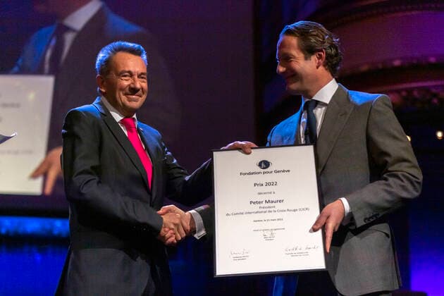 Switzerland: Foundation Award Ceremony for Geneva 2022 Peter Maurer (President of ICRC) (L) receives the Foundation Prize for Geneva for his work with the International Committee of the Red Cross, from the hand of the Marc Pictet (Director of the Pictet group) (R) during the Foundation Award Ceremony for Geneva 2022. Geneva Switzerland Switzerland Copyright: EricxDubost