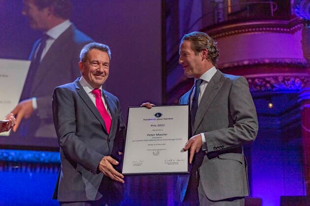 Switzerland: Foundation Award Ceremony for Geneva 2022 Peter Maurer (President of ICRC) (L) receives the Foundation Prize for Geneva for his work with the International Committee of the Red Cross, from the hand of the Marc Pictet (Director of the Pictet group) (R) during the Foundation Award Ceremony for Geneva 2022. Geneva Switzerland Switzerland Copyright: EricxDubost