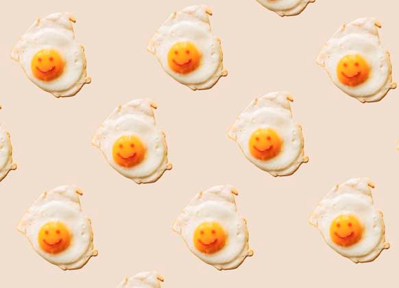 Fried eggs with anthropomorphic smiley faces on yolks, EGHF00373