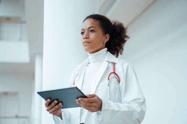 Doctor with tablet computer at medical clinic model released property released, JOSEF07514