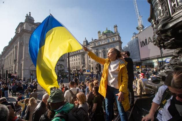 March 26, 2022, London, England, United Kingdom: Tens of thousands march past Yoko OnoÃ¢â‚¬â ¢s Imagine Peace artwork display on Piccadilly Lights in Ã¢â‚¬oeLondon Stands With UkraineÃ¢â‚¬Â march organised by Mayor Sadiq Khan. London United Kingdom - ZUMAs262 20220326_zip_s262_071 Copyright: xTayfunxSalcix