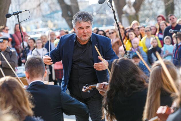 UZHHOROD, UKRAINE - MARCH 25, 2022 - A conductor Viktor Ploskina directs the performance of the Academic Symphony Orchestra of the Philharmonia during the concert in support of the Armed Forces of Ukraine, Uzhhorod, western Ukraine Concert in support of Ukrainian Armed Forces held in Uzhhorod  Copyright: xSerhiixHudakx