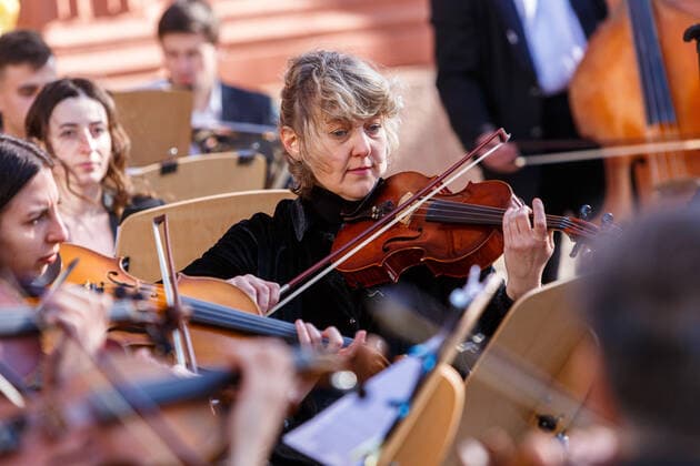 UZHHOROD, UKRAINE - MARCH 25, 2022 - A violinist of the Philharmonic Academic Symphony Orchestra performs during a concert in support of the Armed Forces of Ukraine, Uzhhorod, western Ukraine Concert in support of Ukrainian Armed Forces held in Uzhhorod  Copyright: xSerhiixHudakx