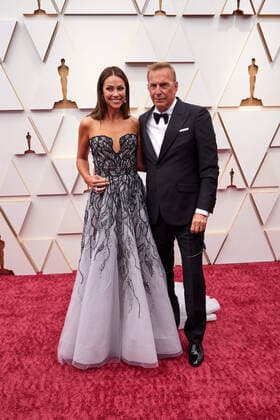 Christine Baumgartner and Kevin Costner arrive on the red carpet of the 94th OscarsÂ® at the Dolby Theatre at Ovation Hollywood in Los Angeles, CA, on Sunday, March 27, 2022.  Copyright: xx 34342-724THA