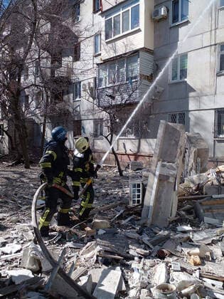 Firefighters use a water hose on a damaged five-storey building after Russian shelling in the city of Sievierodonetsk, Luhansk region, Ukraine, on Tuesday on March 28, 2022. photo by State Emergency Service of Ukraine  KYV2022032920 EmergencyxServicexofxUkraine