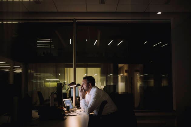 Businessman concentrating while working overtime in office at night Sweden, Stockholm, model released, property released Copyright: xMaskotx , MA92755