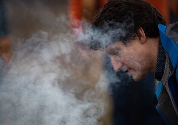 March 30, 2022, WILLIAMS LAKE, BC, CANADA: Smoke rises as Prime Minister Justin Trudeau helps Williams Lake First Nation Chief Willie Sellars start a ceremonial fire on the former grounds of St. Josephs Mission Residential School, in Williams Lake, B.C., on Wednesday, March 30, 2022. In January, the Williams Lake First Nation announced it had identified 93 reflections that could indicate the number of children buried around the site of the former residential school. WILLIAMS LAKE CANADA  - ZUMAc35_ 20220330_zaf_c35_108 Copyright: xDarrylxDyckx