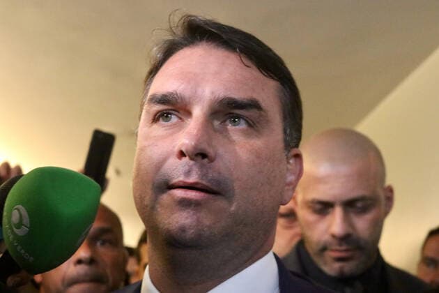 March 30, 2022, Brasilia, Federal District, Brazil: Senator Flavio Bolsonaro gives a press conference alongside federal deputy Daniel Silveira to talk about the decision of Minister Alexandre de Moraes, of the Federal Supreme Court, which determined that the deputy return to use the electronic anklet. During his speech, the son of President Jair Bolsonaro also appealed for something to touch the heart of the STF minister and stressed, in his speech, that Silveira has always been a good guy.  Copyright: xFredericoxBrasilx