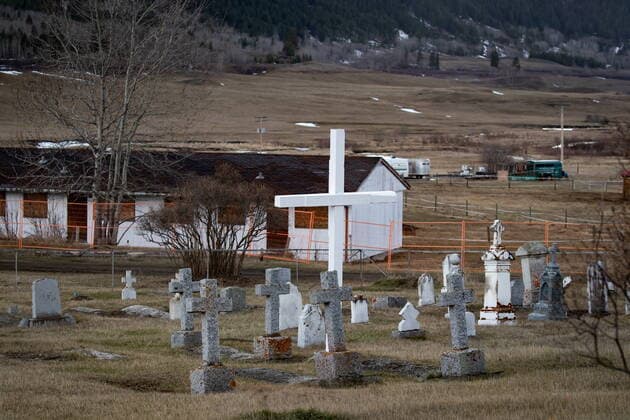 March 30, 2022, WILLIAMS LAKE, BC, CANADA: A cemetery and a boarded up abandoned building are seen on the former grounds of St. Joseph s Mission Residential School, in Williams Lake, B.C., on Wednesday, March 30, 2022. In January, the Williams Lake First Nation announced it had identified 93 reflections that could indicate the number of children buried around the site of the former residential school. WILLIAMS LAKE CANADA  - ZUMAc35_ 20220330_zaf_c35_133 Copyright: xDarrylxDyckx
