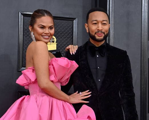 Chrissy Teigen and John Legend arrive for the 64th annual Grammy Awards at the MGM Grand Garden Arena in Las Vegas, Nevada on Sunday, April 3, 2022.  LAV20220403521 JIMxRUYMEN