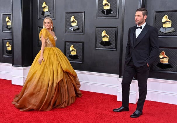 Carrie Underwood and Mike Fisher arrive for the 64th annual Grammy Awards at the MGM Grand Garden Arena in Las Vegas, Nevada on Sunday, April 3, 2022.  LAV20220403604 JIMxRUYMEN