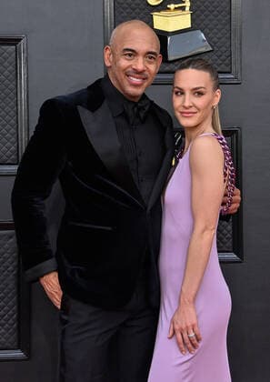 Harvey Mason jr. and Britt Burton arrive for the 64th annual Grammy Awards at the MGM Grand Garden Arena in Las Vegas, Nevada on Sunday, April 3, 2022.  LAV20220403862 JIMxRUYMEN