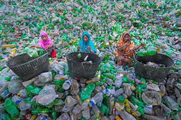 April 4, 2022, Noakhali, Chittagong, Bangladesh: Workers are sorting used plastic bottles in a recycling factory in Noakhali, Bangladesh. Plastic bottles used to package water take over 1,000 years to biodegrade and, if incinerated, produce toxic fumes. Floating plastic waste, which can survive for thousands of years in water, serves as mini transportation devices for invasive species, disrupting habitats. Plastic buried deep in landfills can leach harmful chemicals that spread into groundwater. So, Recycling of plastics is the best way to make the environment safe. Recycling reduces the pollution that can come from the chemicals used to make these bottles. It also helps cut down on the amount of trash thrown into landfills so our garbage d - ZUMAs231 20220404_zip_s231_004 Copyright: xJoyxSahax