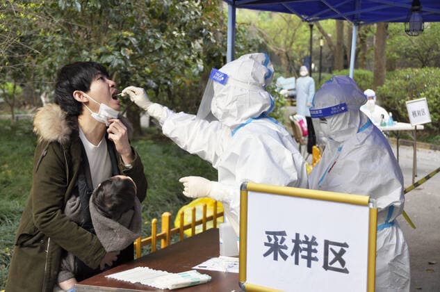 Lockdown in Shanghai A man takes a PCR test for the novel coronavirus in Shanghai on April 4, 2022, as a lockdown continues in the city to curb infections.  A14AA0001276496P