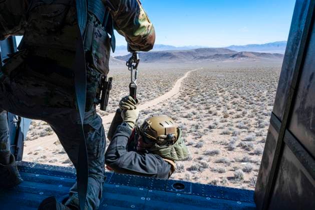 March 10, 2022 - Nellis Air Force Base, Nevada, USA - Airman 1st Class Sean McIntyre, 55th Rescue Squadron special missions aviator assigned to Davis-Monthan Air Force Base, Arizona, hoists Major Christopher Leonard, 366th Fighter Wing chief of wing weapons and tactics, in to a rescue helicopter for a combat search and rescue exercise during Red Flag-Nellis 22-2, at the Nevada Test and Training Range, March 10, 2022. Since 2003, the 55th Rescue Squadron has provided rapidly deployable combat search and rescue forces worldwide. Nellis Air Force Base USA - ZUMAz03_ 20220310_ssw_z03_180 Copyright: xU.S.xAirxForcex