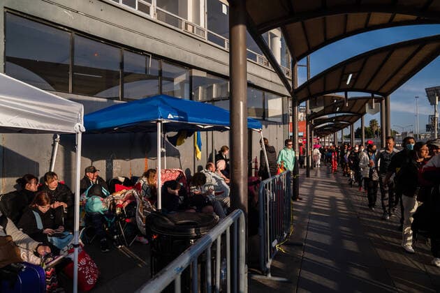 Ukrainians who fled to Mexico amid Russia s invasion of Ukraine wait in front of the San Ysidro Port of Entry of the U.S.-Mexico border on Monday, April 4, 2022 in Tijuana, Mexico. The refugees are given a number so they do not have to wait in line as the United States said they will accept 100,000 Ukrainian refugees due to the Russian invasion of Ukraine.  MEX2022040412 ARIANAxDREHSLER