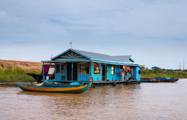 Floating village on Lake Tonle Sap in Cambodia with some houses made from boats , 2987597.jpg, Boat, House, architecture, asia, asian, building, cambodia, cambodian, culture, fisherman, fishing, float, floating, home, houseboat, khmer, lake, life, mekong, nature, nautical, peaceful, pier, poor, poverty, raft, reap, reflection, river, rural, sap, settlement, siem, thailand, tonle, tourism, tradition, traditional, tranquil, transport, travel, tropical, vietnam, village, water, wooden,