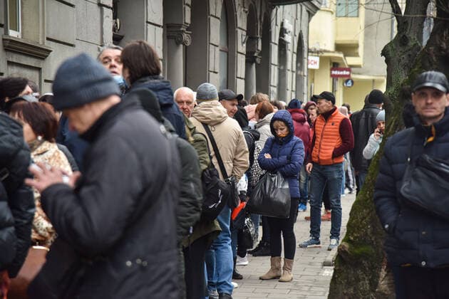 March 31, 2022, Lviv, Ukraine: People stand in a line at the UN refugee office in Lviv to register as refugees due to Russia s military invasion of Ukraine. The UN Office for Refugees, which registers refugees from Russian military aggression in Ukraine, has opened in Lviv. Each refugee will receive 2,200 hryvnias (equivalent to $ 80) from the UN each month for three months. Currently, such offices operate only in three Ukrainian cities - Lviv, Uzhhorod, and Mukachevo. Lviv Ukraine - ZUMAs197 20220331_zab_s197_099 Copyright: xPavloxPalamarchukx