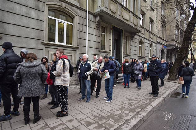 March 31, 2022, Lviv, Ukraine: People stand in a line at the UN refugee office in Lviv to register as refugees due to Russia s military invasion of Ukraine. The UN Office for Refugees, which registers refugees from Russian military aggression in Ukraine, has opened in Lviv. Each refugee will receive 2,200 hryvnias (equivalent to $ 80) from the UN each month for three months. Currently, such offices operate only in three Ukrainian cities - Lviv, Uzhhorod, and Mukachevo. Lviv Ukraine - ZUMAs197 20220331_zab_s197_100 Copyright: xPavloxPalamarchukx
