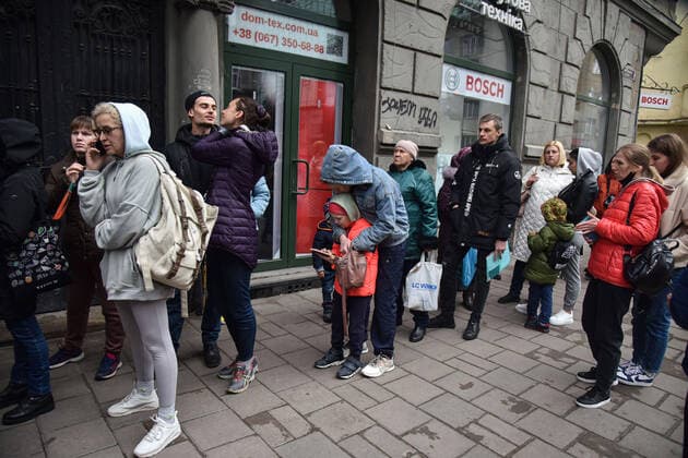 March 31, 2022, Lviv, Ukraine: People stand in a line at the UN refugee office in Lviv to register as refugees due to Russia s military invasion of Ukraine. The UN Office for Refugees, which registers refugees from Russian military aggression in Ukraine, has opened in Lviv. Each refugee will receive 2,200 hryvnias (equivalent to $ 80) from the UN each month for three months. Currently, such offices operate only in three Ukrainian cities - Lviv, Uzhhorod, and Mukachevo. Lviv Ukraine - ZUMAs197 20220331_zab_s197_103 Copyright: xPavloxPalamarchukx