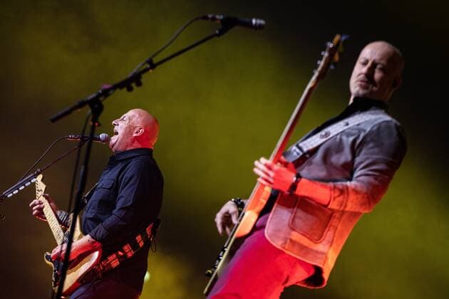 2022-04-08 19:28:27 AMSTERDAM - The Zeeland band BLOF with on the left lead singer and guitarist Paskal Jakobsen and bassist Peter Slager during a performance in the Ziggo Dome. The band is celebrating their thirtieth anniversary with two anniversary concerts. ANP KIPPA PAUL BERGEN netherlands out - belgium out