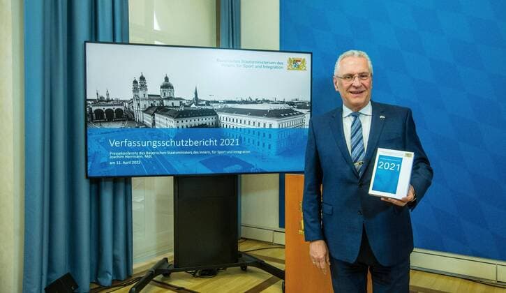 News Themen der Woche KW15 News Bilder des Tages April 11, 2022, Munich, Bavaria, Germany: JOACHIM HERRMANN, Interior Minister of the State of Bavaria. The Bavarian Verfassungsschutz (Secret Service, Office for the Protection of the Constitution) released the 2021 report detailing threats to the state of Bavaria and the country. Over the past years, conspiracy theorists, new age and wellness extremists, right-extremists, and various enemies of democracy have taken a leading role against the German state and society, with imagery such as the August 2020 storming of the Reichstag and May 2020 3,000 Corona rebels demonstrating at Marienplatz in Munch associated with it. Numerous participants in that storming come from the Bavarian scene and are radicalizing at increasing rates. Munich Ge - ZUMAb160 20220411_zbp_b160_043 Copyright: xSachellexBabbarx