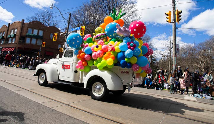 (220417) -- TORONTO, April 17, 2022 -- A vehicle filled with colorful balloons is seen during the 2022 Toronto Beaches Lions Easter Parade in Toronto, Canada, on April 17, 2022. The Toronto Beaches Lions Easter Parade returned on Sunday after a three-year hiatus due to the COVID-19 pandemic. (Photo by Xinhua) CANADA-TORONTO-EASTER-PARADE ZouxZheng 