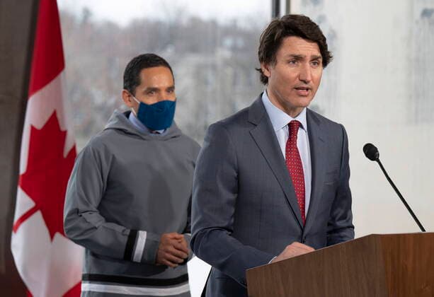 April 21, 2022, Ottawa, ON, Canada: President of the Inuit Tapiriit Kanatami Natan Obed looks on as Canadian Prime Minister Justin Trudeau speaks during a news conference following a meeting of the Inuit-Crown Partnership Committee, Thursday, April 21, 2022 in Ottawa. Ottawa Canada  - ZUMAc35_ 20220421_zaf_c35_024 Copyright: xAdrianxWyldx