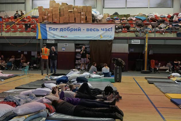 April 21, 2022, Tijuana, Baja California, Mexico: Ukrainian refugees waiting for their turn to get bused for processing to enter the U.S. at the Benito Juarez Sports Complex in Tijuana, Mexico on Thursday, April 21, 2022. ..The Biden Administration announced today that the United States will no longer accept Ukrainian refugees who arrive at the U.S.-Mexico border to seek asylum, instead they will proceeded directly when arriving only via Europe to the States...The move is expected to speed up the processing of applications for Ukrainian refugees and others fleeing war, but it will no longer routinely grant entry to anyone who shows up at the border which thousands have done so previously since the Russian invasion of Ukraine on February 24. - ZUMAm180 20220421_zip_m180_003 Copyright: xCarlosxA.xMorenox
