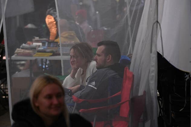 April 21, 2022, Tijuana, Baja California, Mexico: Ukrainian refugees waiting for their turn to get bused for processing to enter the U.S. at the Benito Juarez Sports Complex in Tijuana, Mexico on Thursday, April 21, 2022. ..The Biden Administration announced today that the United States will no longer accept Ukrainian refugees who arrive at the U.S.-Mexico border to seek asylum, instead they will proceeded directly when arriving only via Europe to the States...The move is expected to speed up the processing of applications for Ukrainian refugees and others fleeing war, but it will no longer routinely grant entry to anyone who shows up at the border which thousands have done so previously since the Russian invasion of Ukraine on February 24. - ZUMAm180 20220421_zip_m180_006 Copyright: xCarlosxA.xMorenox