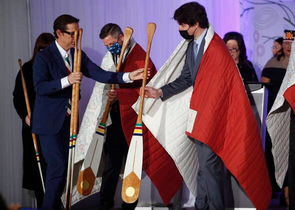 April 22, 2022, WINNIPEG, MANITOBA, CANADA: HudsonöÄÃ s Bay Company governor Richard Baker gives a paddle to Prime Minister Justin Trudeau at a HudsonöÄÃ s Bay Company transfer ceremony in Winnipeg Friday, April 22, 2022. One of the landmark stores formerly run by the HudsonöÄÃ s Bay Company is about to undergo a major transformation in the name of reconciliation with Indigenous people. WINNIPEG CANADA  - ZUMAc35_ 20220422_zaf_c35_030 Copyright: xJohnxWoodsx