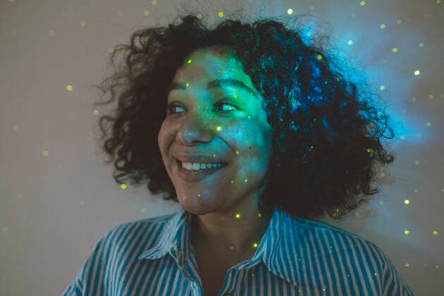 Astro light effect falling on face of woman in front of wall model released, Symbolfoto property released, JOSEF07768