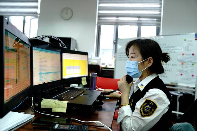 (220423) -- SHANGHAI, April 23, 2022 -- A staff member talks on the phone to dispatch ambulances at the medical emergency center of Minhang District of Shanghai, east China, April 23, 2022. The medical emergency center of Minhang District of Shanghai has made emergent purchase of ambulances and has sent an increased number of medical workers to ensure the city s public medical emergency service amid the COVID-19 resurgence. ) CHINA-SHANGHAI-MEDICAL EMERGENCY SERVICE (CN) ZhangxJiansong 