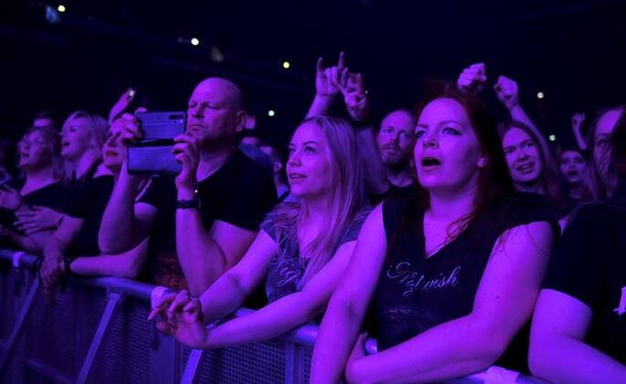 Fans of cheers as the Finnish symphonic metal band Nightwish performs on stage during their concert in Helsinki, Finland, on April 24, 2022. Helsinki Finland  Copyright: xHeikkixSaukkomaax LKLAPH20220424212334Q818