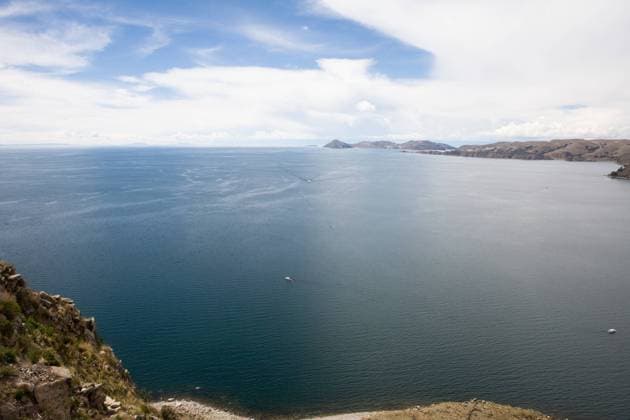 Copacabana is the main Bolivian town on Lake Titicaca, from where boats leave for Isla del Sol, the sacred Inca island. , 348778.jpg, Bolivia, Peru, Copacabana, South America, Lake Titicaca, water, landscape, clouds, sky, Andes, beach, boats,