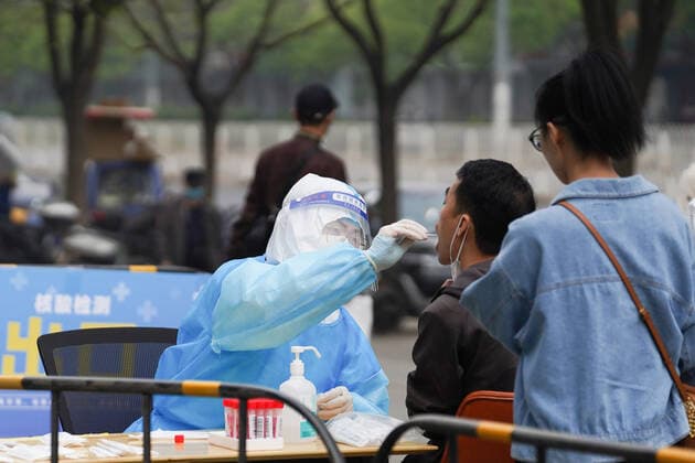 (220425) -- BEIJING, April 25, 2022 -- A medical worker takes a swab sample from a resident for nucleic acid test at a testing site in Chaoyang District, Beijing, capital of China, April 25, 2022. Starting from Monday, people who live and work in the Chaoyang District have to take nucleic acid test every two days till April 29 to curb the recent resurgence of COVID-19 here. ) CHINA-BEIJING-COVID-19-NUCLEIC ACID TEST (CN) JuxHuanzong 