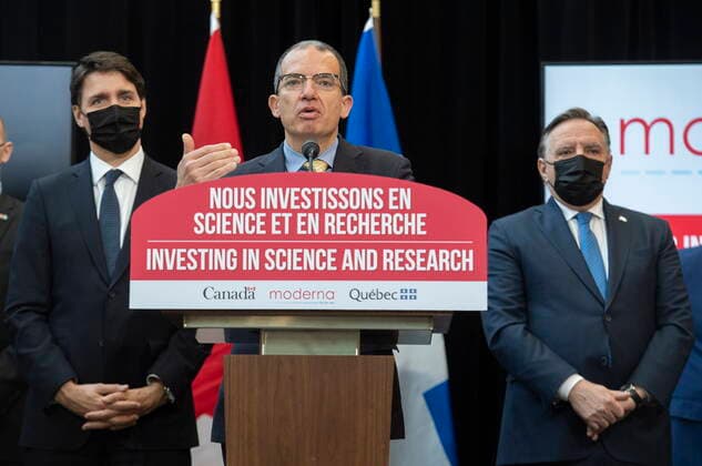 April 29, 2022, Montreal, PQ, Canada: Quebec Premier Francois Legault, right, and Prime Minister Justin Trudeau, left, look on as Moderna global CEO Stephane Bancel speaks during an announcement of the opening of a Moderna vaccine production and research facility in Montreal, Friday, April 29, 2022. Montreal Canada - ZUMAc35_ 20220429_zaf_c35_041 Copyright: xGrahamxHughesx