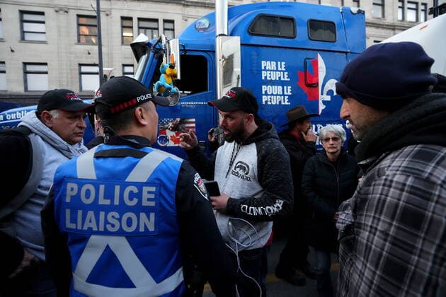 April 29, 2022, Ottawa, ON, CANADA: A protesting truck driver, centre, discusses with police liaison how to leave the area during a demonstration, part of a convoy-style protest participants are calling Rolling Thunder , in Ottawa, Friday, April 29, 2022. Ottawa CANADA  - ZUMAc35_ 20220429_zaf_c35_110 Copyright: xSeanxKilpatrickx
